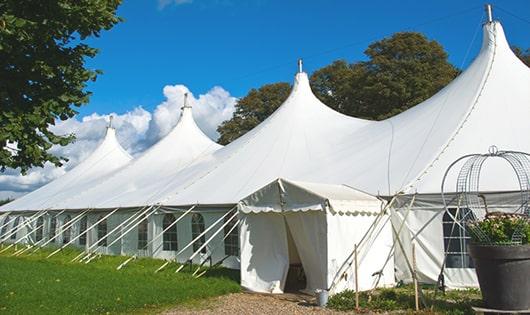 a line of portable toilets in a shaded area, offering a comfortable experience for users in Chesterfield